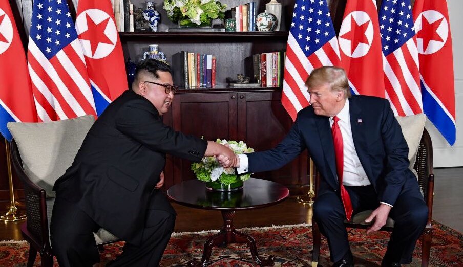 US President Donald Trump and North Korean Supreme Leader Kim Jong Un shake hands at a summit meeting between the countries on June 12, 2018. 